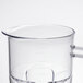 A clear beaker with a handle, lid, and blade for a Waring commercial blender.
