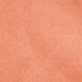 A close-up of an orange Intedge cloth napkin.