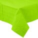 A Fresh Lime Green Creative Converting Table Cover on a white table.