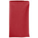 A folded red Intedge cloth napkin.
