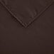 A close up of a brown 100% polyester hemmed cloth table cover.