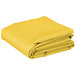 A folded yellow rectangular Intedge table cover.