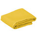A yellow folded Intedge square table cover.