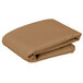 A stack of beige square cloth table covers.