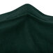 A close-up of a hunter green Snap Drape Contour Spandex table cover.