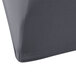 A close-up of a grey fabric surface with a Snap Drape Contour Charcoal Spandex Table Cover on it.