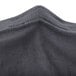 A charcoal Snap Drape spandex table cover with a zipper on the back.