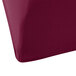 A burgundy Snap Drape Contour table cover on a table.