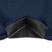 A close up of a navy blue spandex table cover with a black zipper.