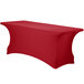 A crimson Snap Drape Contour Spandex table cover with a curved edge on a table.