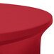 A red Snap Drape spandex table cover on a round table.