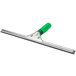 An Unger window squeegee with a green ergonomic handle.
