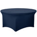 A round table with a navy blue Snap Drape spandex cover.