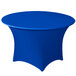 A royal blue Snap Drape spandex table cover with a round top on a table.