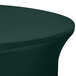 A Hunter Green Snap Drape Contour Spandex Table Cover on a round table.