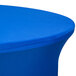 A royal blue Snap Drape spandex table cover on a round table.