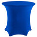 A royal blue Snap Drape contour spandex table cover on a round table.