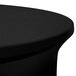 A black Snap Drape Contour spandex table cover on a round table.