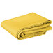 A folded yellow Intedge table cover on a white background.