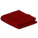 A red folded rectangular Intedge table cover.