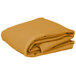 A stack of folded gold rectangular table covers on a white background.