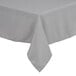 A gray rectangular tablecloth with a hemmed edge on a table.