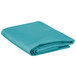 A folded teal rectangular table cover.