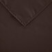 A dark brown rectangular cloth table cover with a hemmed corner.