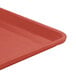 A close-up of a raspberry cream Cambro dietary tray.