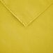 A yellow rectangular cloth table cover with a hemmed edge.