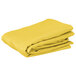 A stack of yellow folded Intedge round table covers.