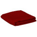A folded red rectangular Intedge table cover on a white background.