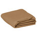 A folded beige rectangular Intedge table cover.