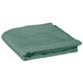 A folded seafoam green Intedge table cover.