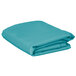 A stack of folded teal rectangular table covers on a white background.
