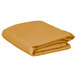 A stack of folded gold rectangular Intedge table covers.