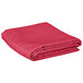 A folded hot pink Intedge rectangular table cover.
