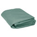 A stack of folded seafoam green Intedge tablecloths on a white background.