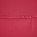 A close-up of a hot pink hemmed table cover.