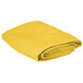 A folded yellow Intedge square table cover on a white background.