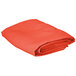 An orange Intedge square table cover folded on a white background.