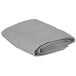 A folded gray Intedge square table cover.