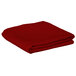 A folded red table cover on a white background.
