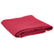 A folded hot pink Intedge cloth table cover.