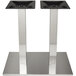 A pair of brushed stainless steel rectangular table bases with double columns.