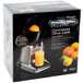 A box of Proctor Silex Electric Citrus Juicer with oranges and limes.