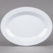 A white plate with a curved edge.