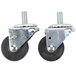 A pair of Master-Bilt stem casters with black rubber wheels and nuts on them.