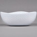 A white melamine triangle bowl with a textured pattern.