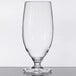 A clear GET Tritan plastic goblet on a table.